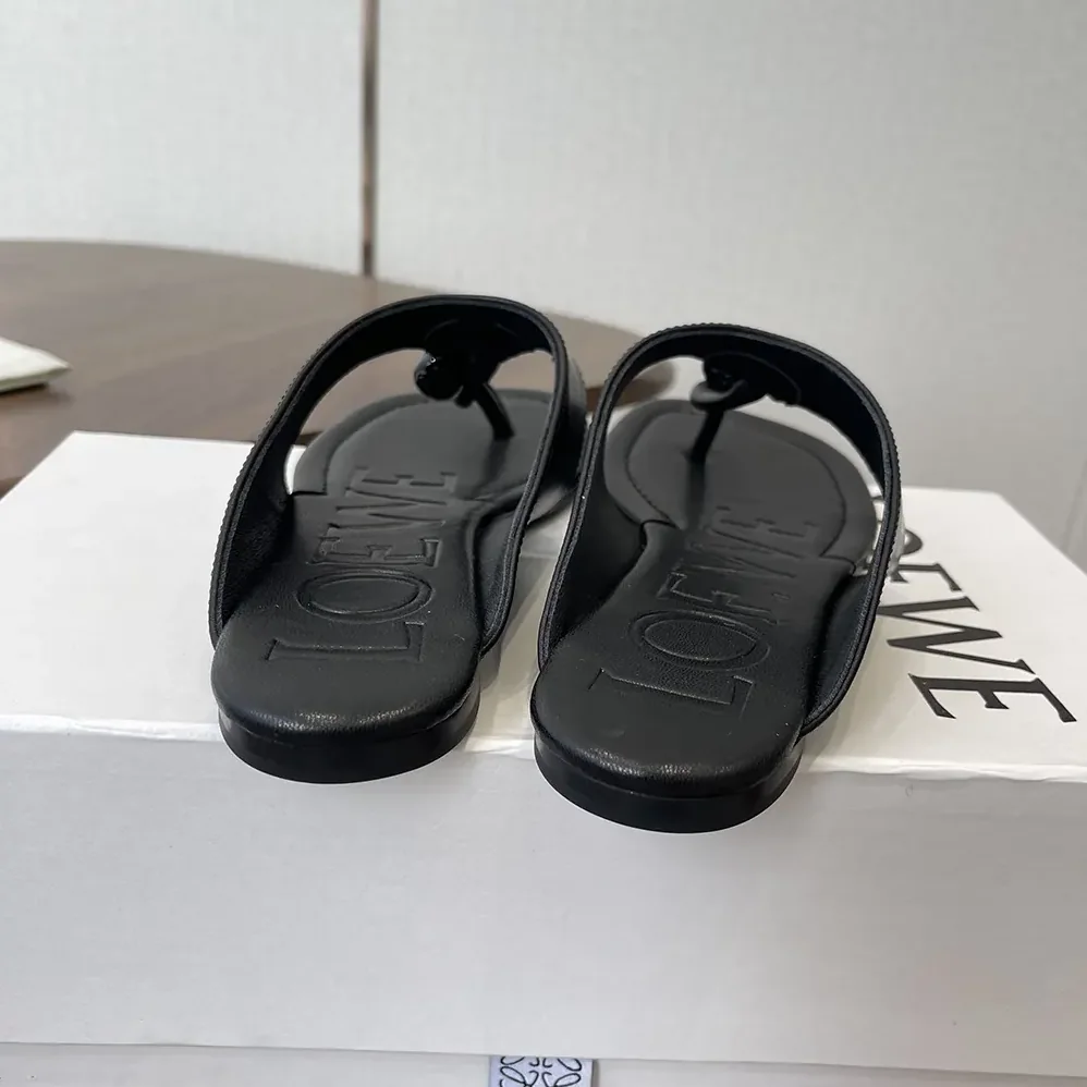 Loewe Toggle Flat Sandal in Shiny Smoot Calfskin for Women in Black Loewe Toggle Flat Sandal in Shiny Smoot Calfskin for Women in Black