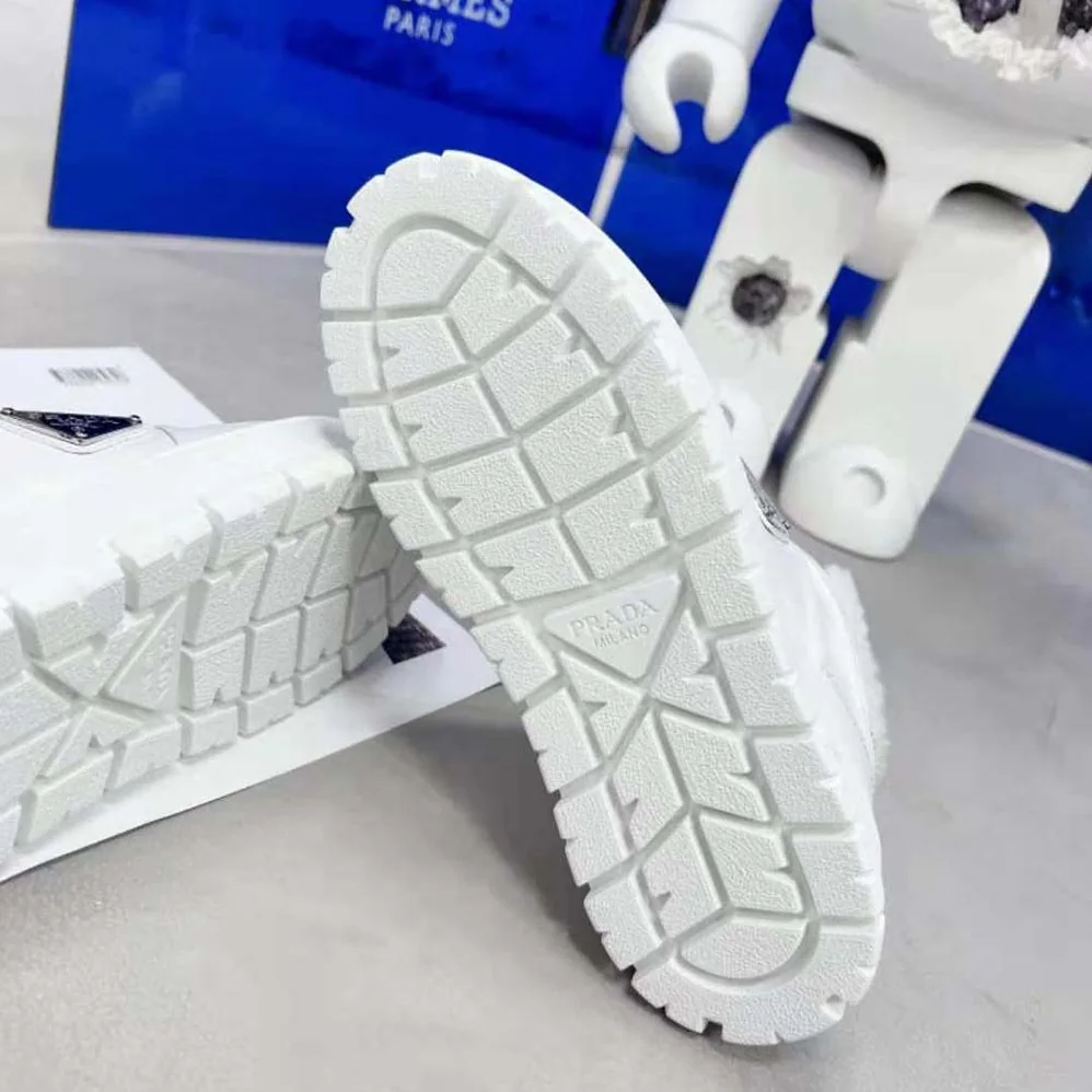 Prada Leather and Shearling Sneakers for Women in White