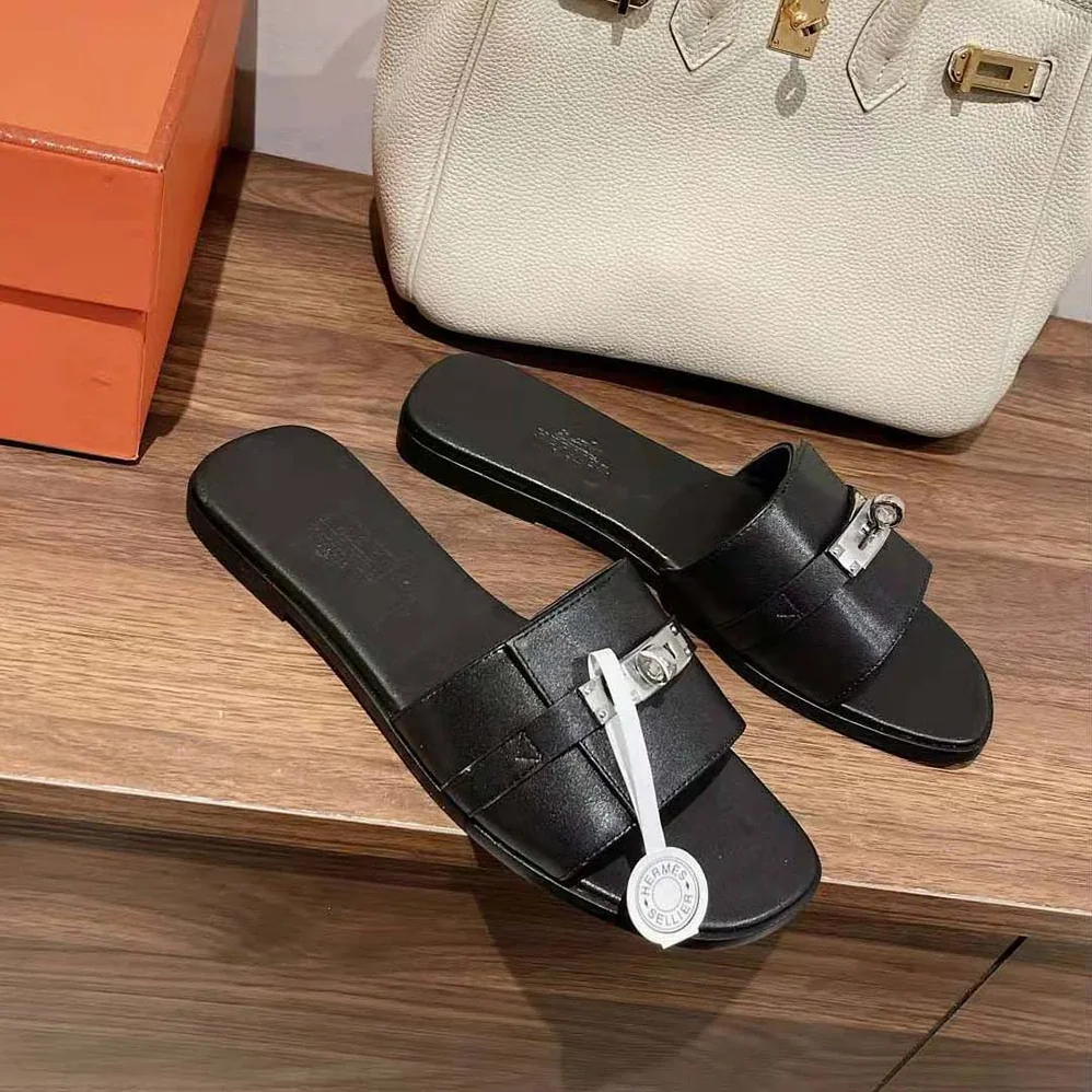 Hermes Giulia Sandal in Calfskin with Iconic Palladium-Plated Kelly Buckle for Women in Black Hermes Giulia Sandal in Calfskin with Iconic Palladium-Plated Kelly Buckle for Women in Black