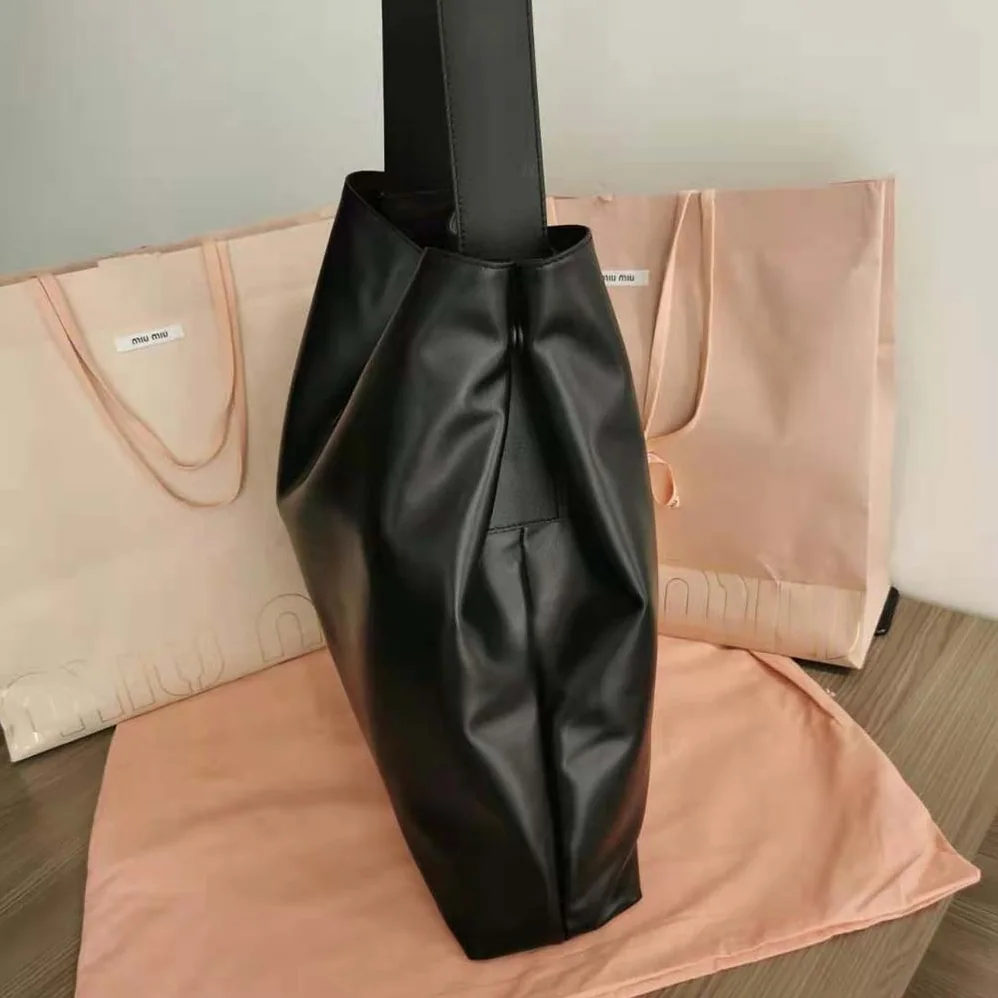 Miu Miu Leather Shoulder Bag with Embossed Lettering Logo on the Front for Women