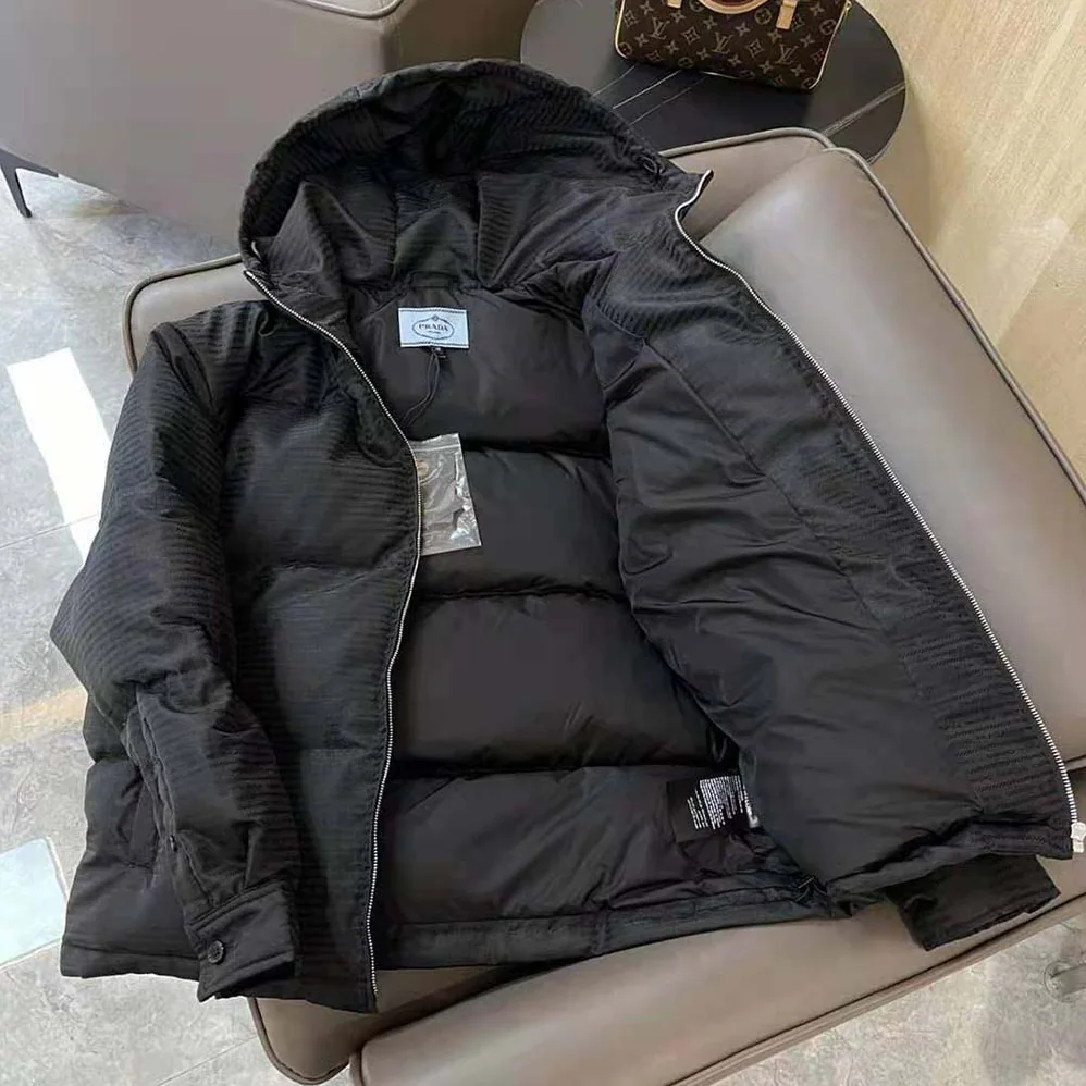 Prada Re-Nylon Hooded Down Jacket for Men in Black Prada Re-Nylon Hooded Down Jacket for Men in Black