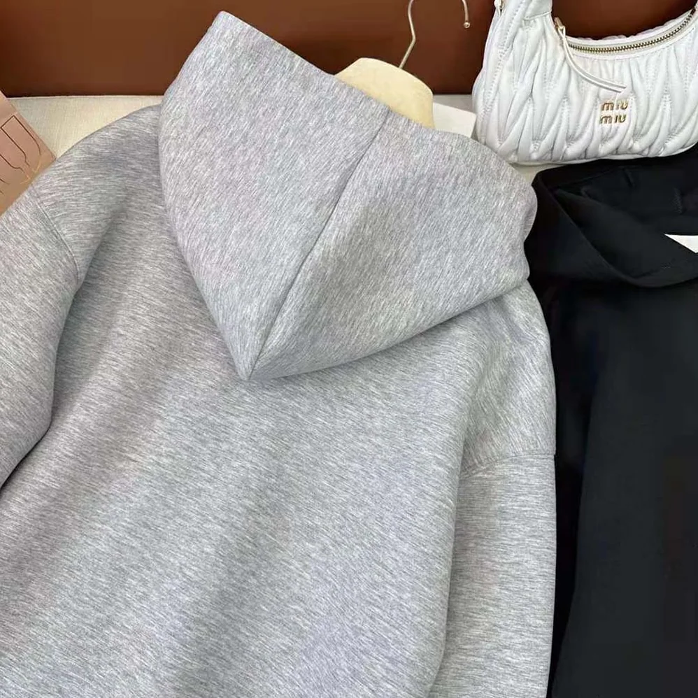 Miu Miu Embroidered Cotton Fleece Hoodie with Embroidered Logo for Women in Silver Miu Miu Embroidered Cotton Fleece Hoodie with Embroidered Logo for Women in Silver