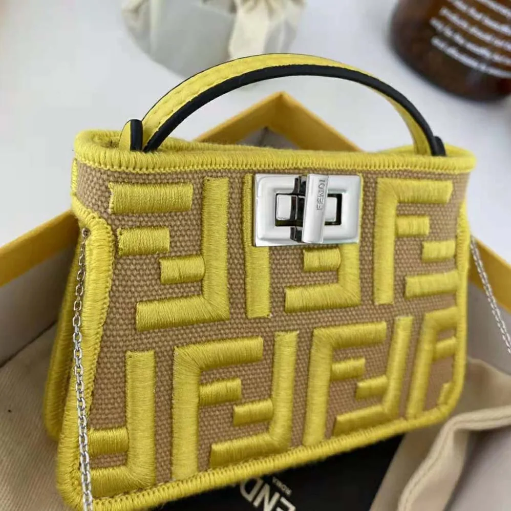 Fendi Nano Peekaboo Charm Gray FF Canvas Charm for Women in Yellow Fendi Nano Peekaboo Charm Gray FF Canvas Charm for Women in Yellow