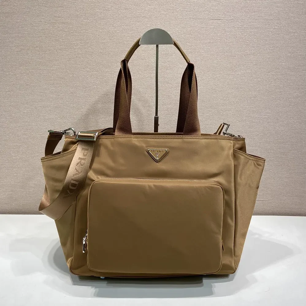 Prada Re-Nylon Baby Bag with Triangle Logo for Unisex in Brown Prada Re-Nylon Baby Bag with Triangle Logo for Unisex in Brown