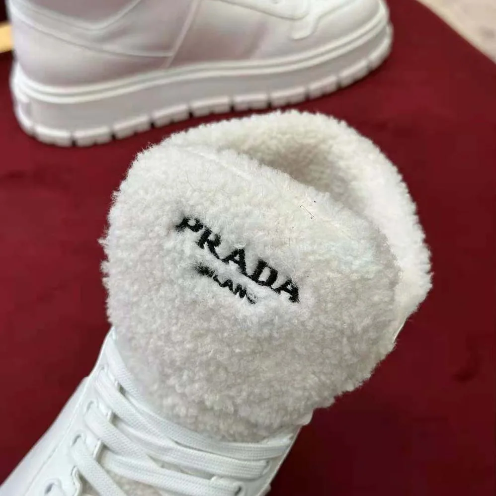 Prada Leather and Shearling High-Top Sneakers for Women in White Prada Leather and Shearling High-Top Sneakers for Women in White