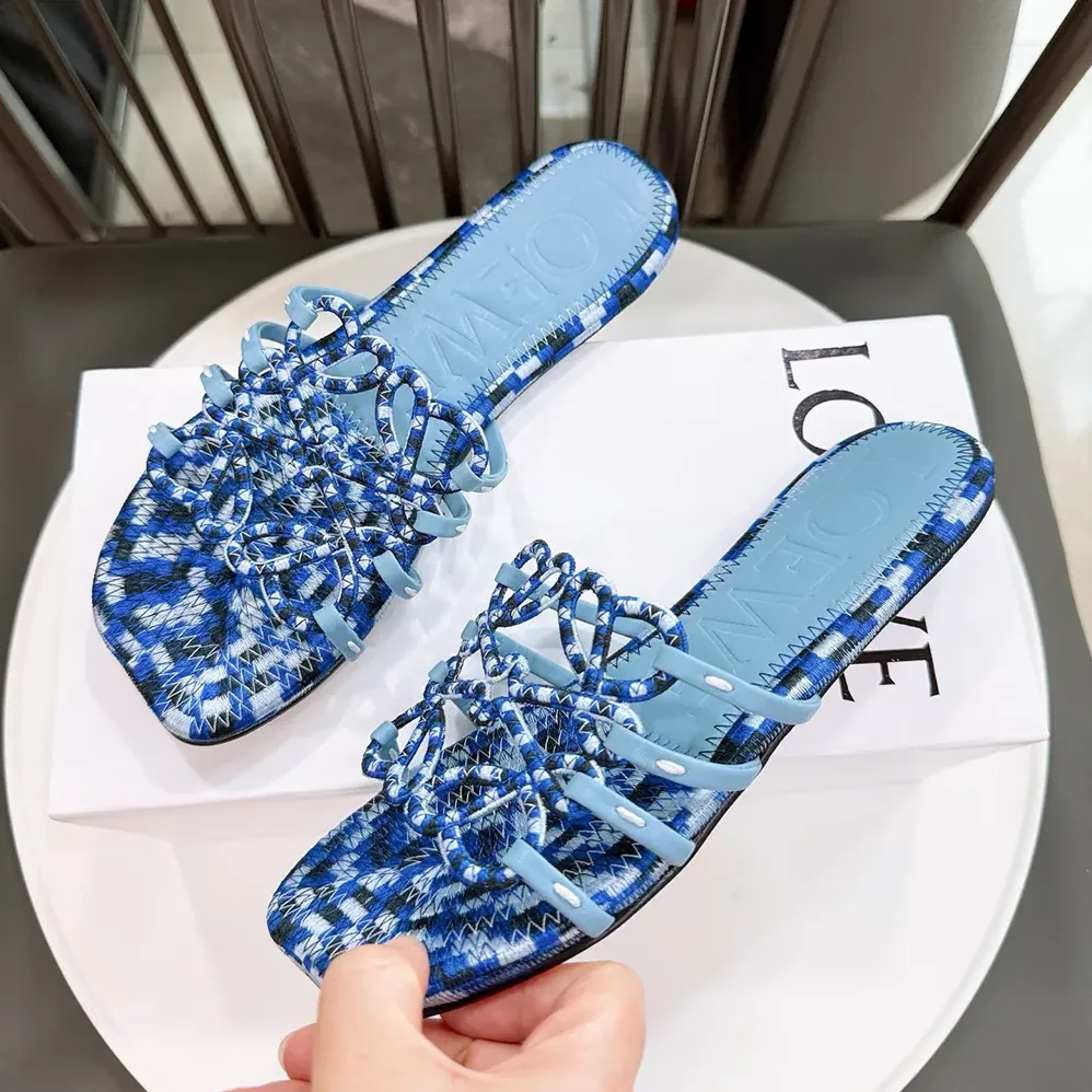 Loewe Petal Anagram Slide in Embroidered Canvas for Women in Baby Blue Loewe Petal Anagram Slide in Embroidered Canvas for Women in Baby Blue
