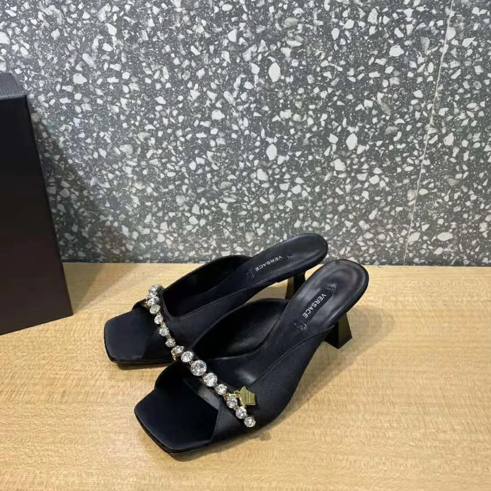 Versace Artifact Mid-Heel Mules for Women in Black Versace Artifact Mid-Heel Mules for Women in Black