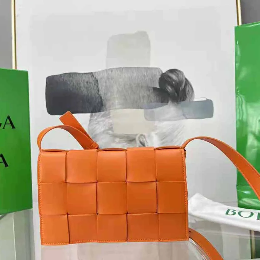 Bottega Veneta Cassette Intreccio Leather Cross-Body Bag for Women in Orange Bottega Veneta Cassette Intreccio Leather Cross-Body Bag for Women in Orange