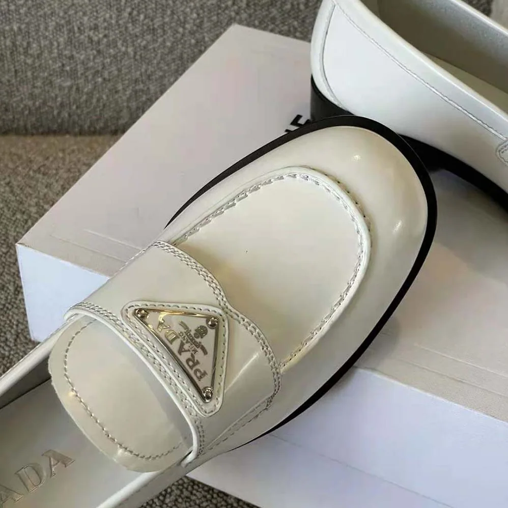 Prada Patent Leather Loafers in 25 mm Heel Height for Women in White Prada Patent Leather Loafers in 25 mm Heel Height for Women in White