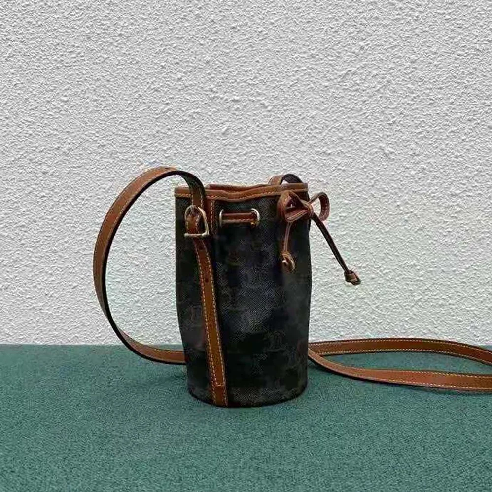 Celine Micro Drawstring in Triomphe Canvas and Calfskin for Women in Brown Celine Micro Drawstring in Triomphe Canvas and Calfskin for Women in Brown
