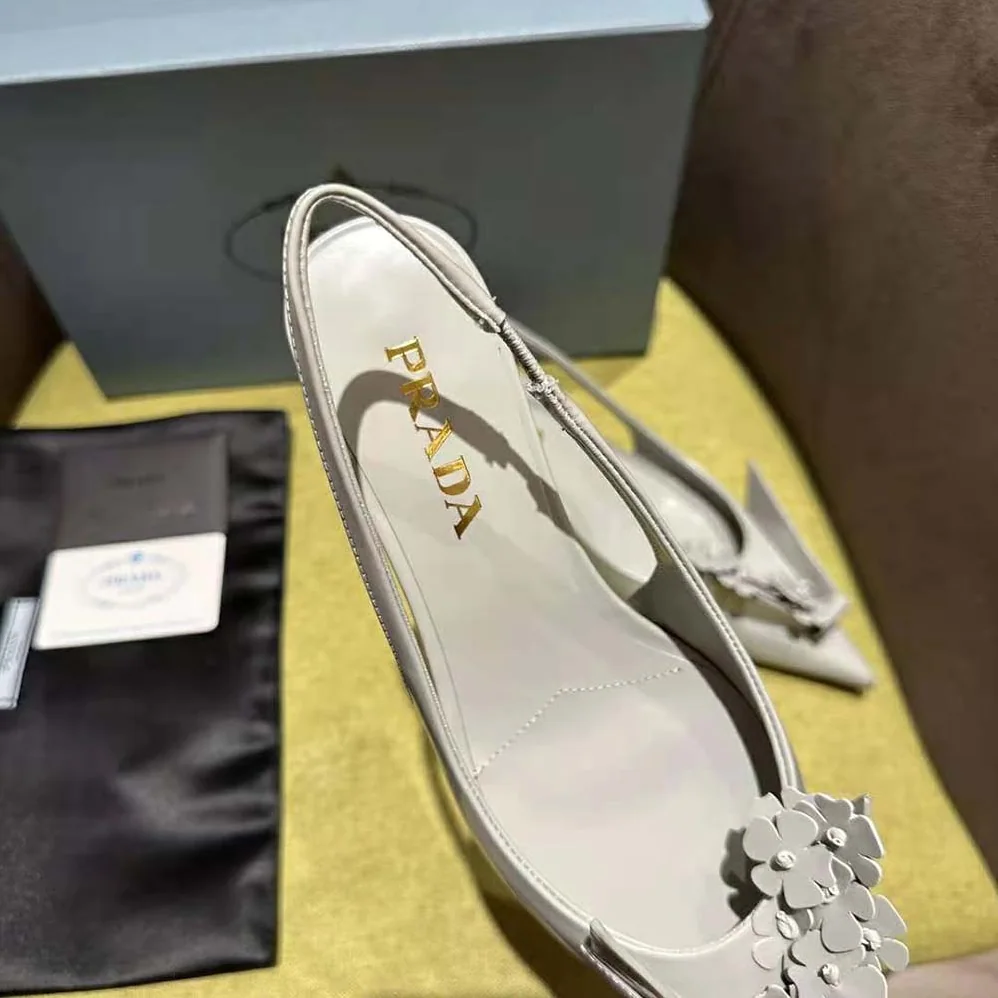 Prada Brushed Leather Slingback Pumps with Floral Appliques for Women in Gray Prada Brushed Leather Slingback Pumps with Floral Appliques for Women in Gray