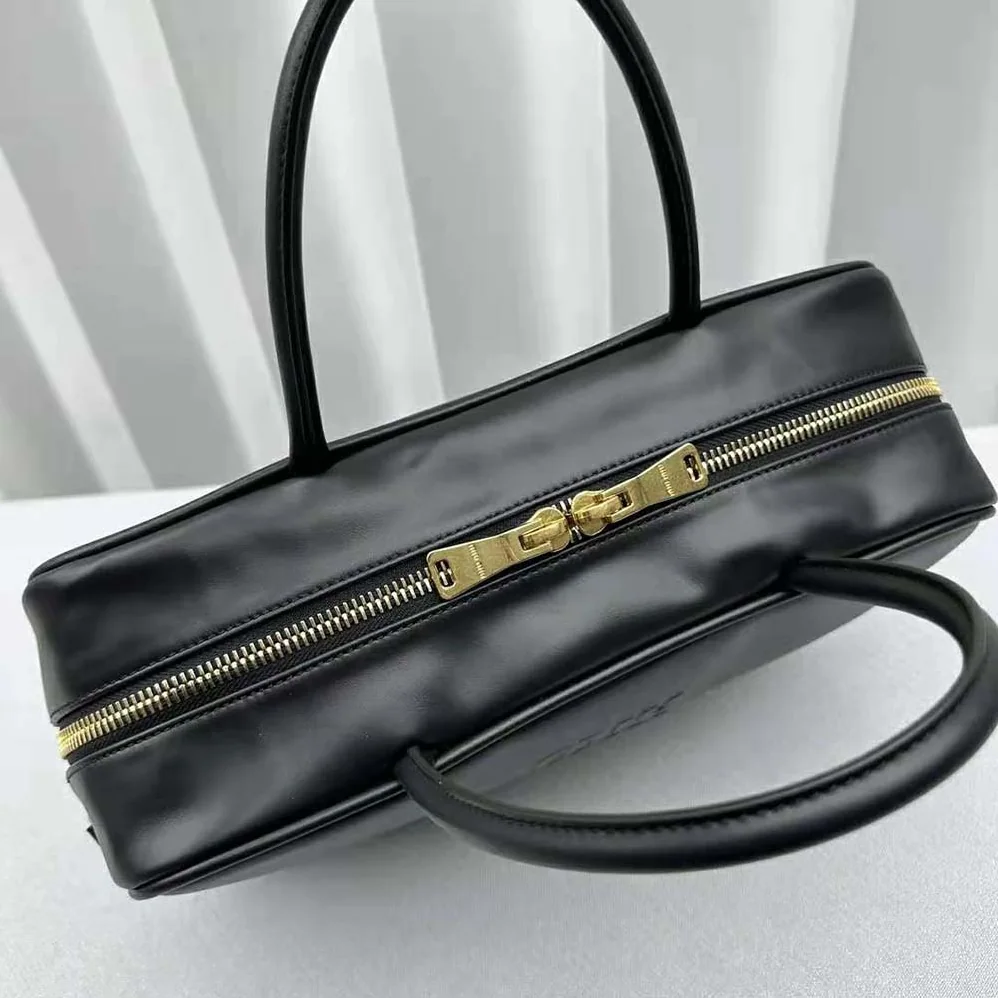 Miu Miu Leather Top-handle Bag with Embossed Lettering Logo for Women in Black Miu Miu Leather Top-handle Bag with Embossed Lettering Logo for Women in Black