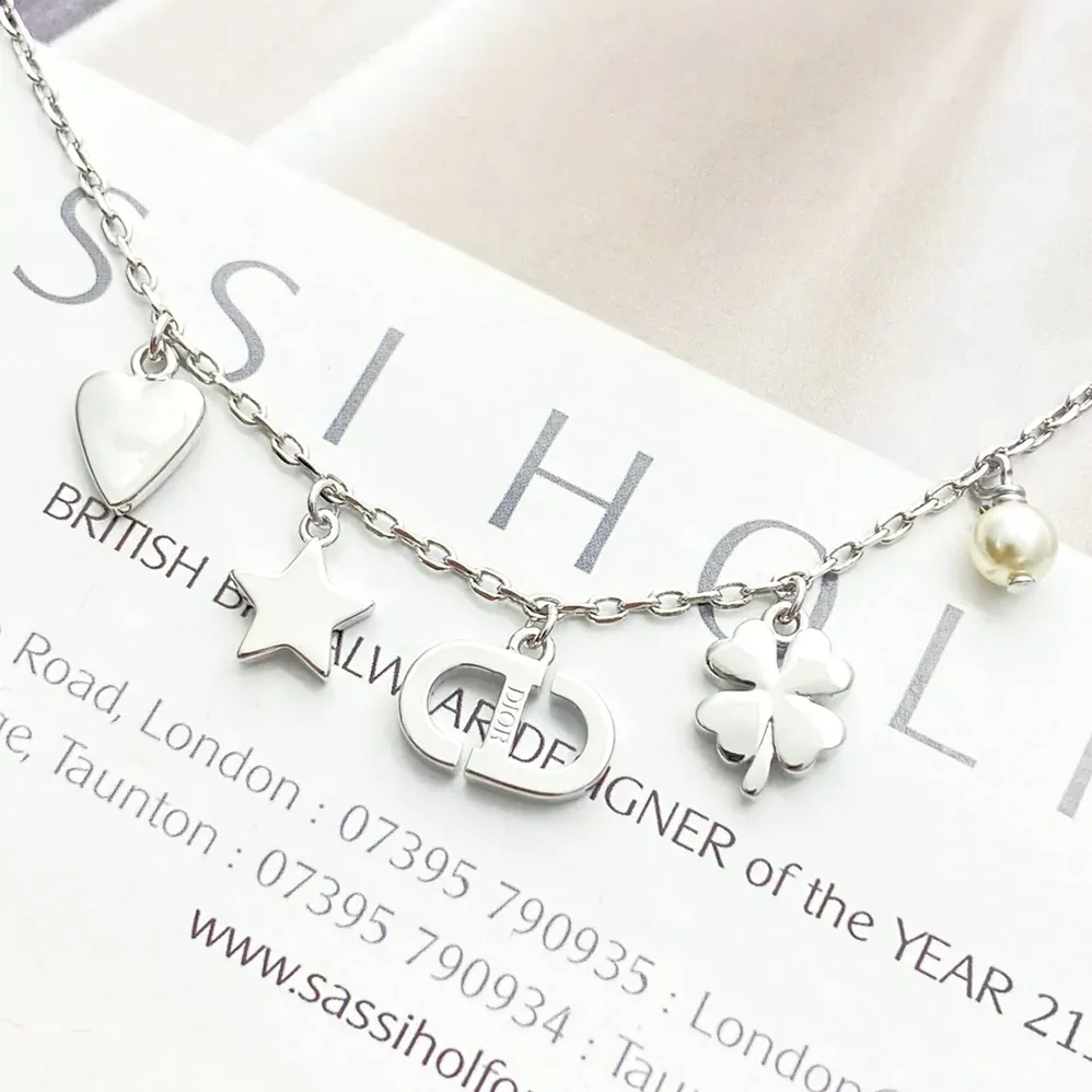 Dior Petit CD Lucky Charms Bracelet Silver-Finish Metal with White Resin Pearl and Silver for Women in Tone Crystals Dior Petit CD Lucky Charms Bracelet Silver-Finish Metal with White Resin Pearl and Silver for Women in Tone Crystals