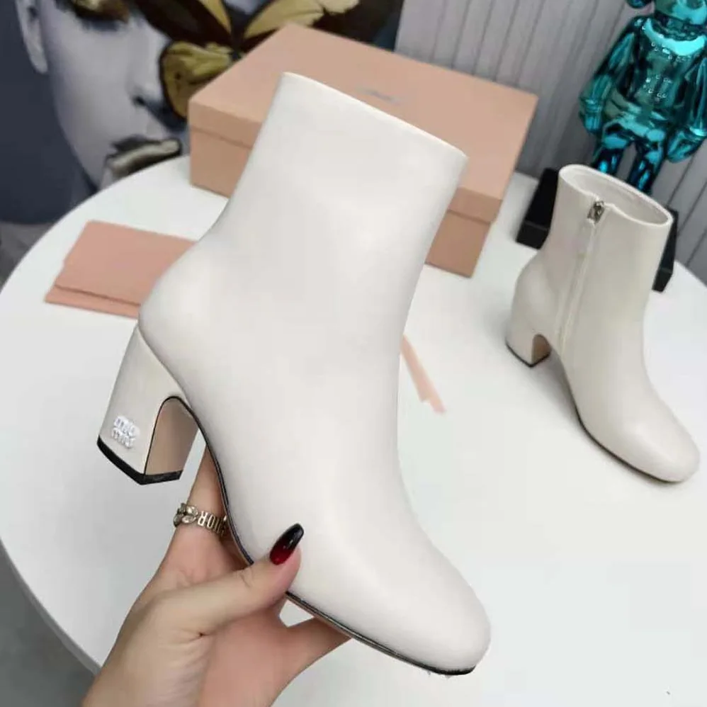 Miu Miu Leather Booties with Metal Lettering Logo for Women in White