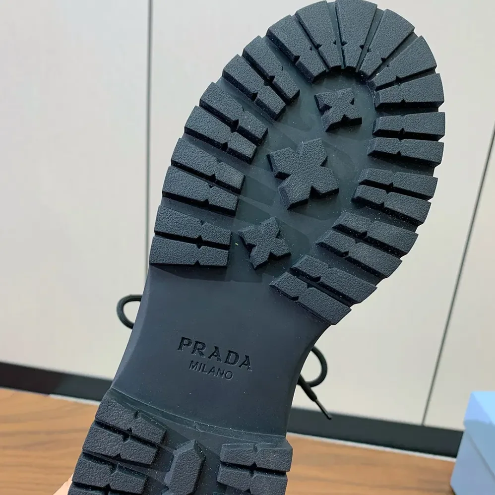 Prada Leather and Re-Nylon booties for Unisex in Ebony