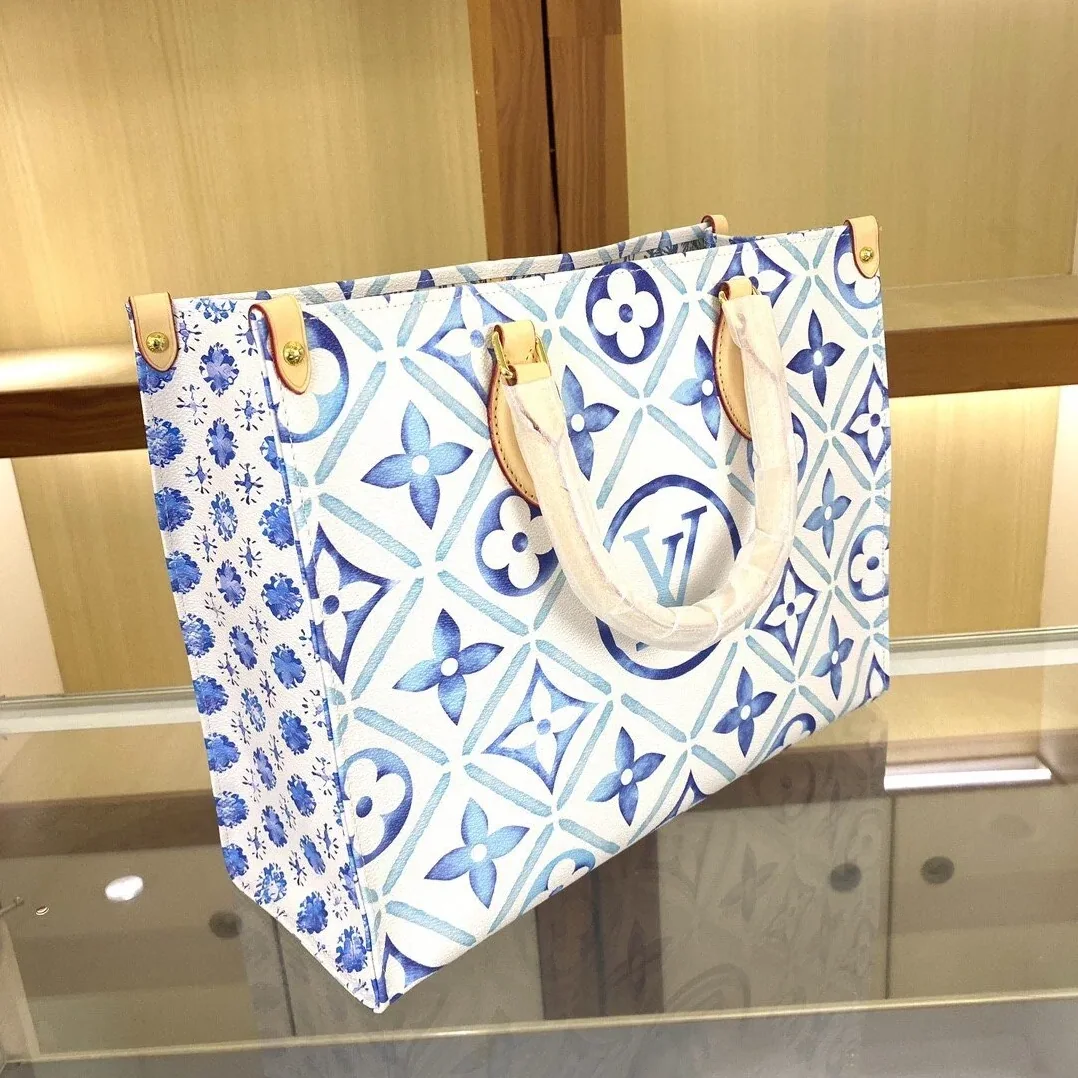 Louis Vuitton OnTheGo MM Tote Bag in Blue Gold Hardware