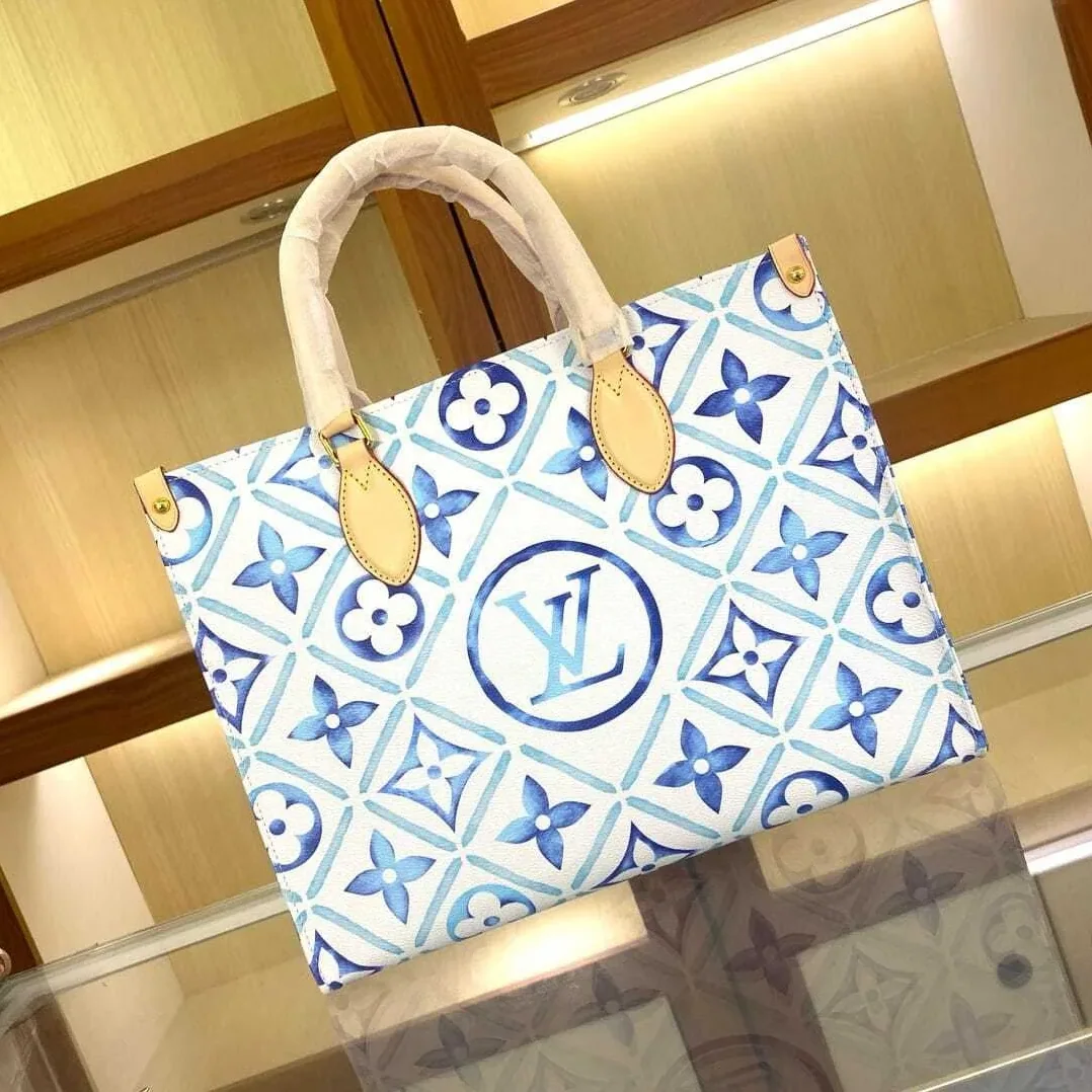 Louis Vuitton OnTheGo MM Tote Bag in Blue Gold Hardware