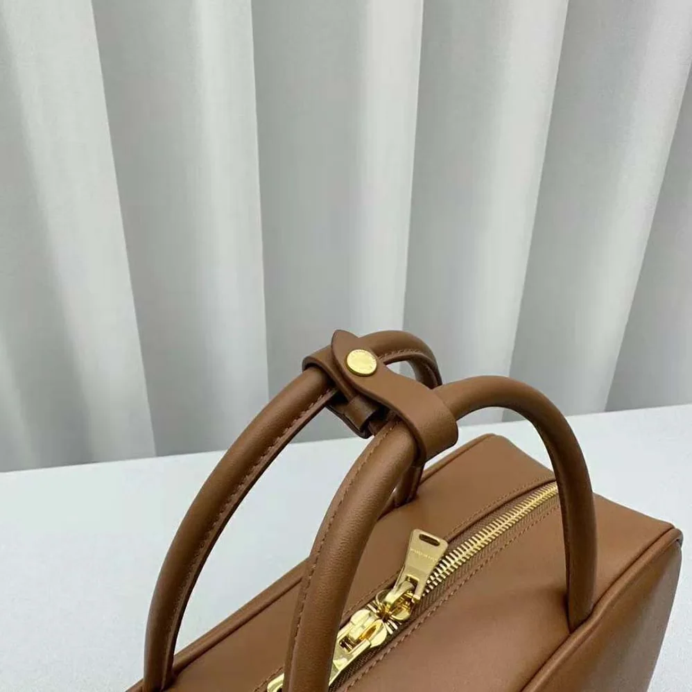 Miu Miu Leather Top-handle Bag with Embossed Lettering Logo for Women in Brown Miu Miu Leather Top-handle Bag with Embossed Lettering Logo for Women in Brown