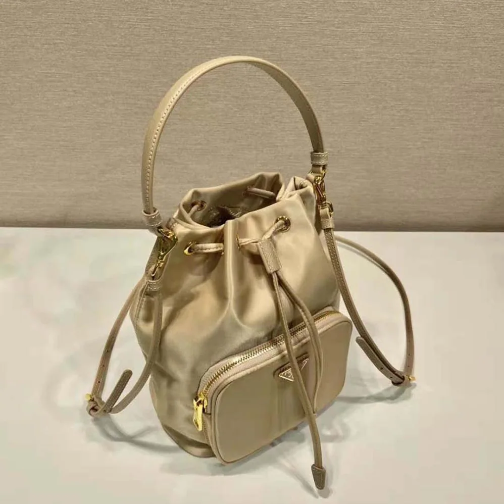 Prada Duet Re-Nylon Bucket Bag for Women in Beige