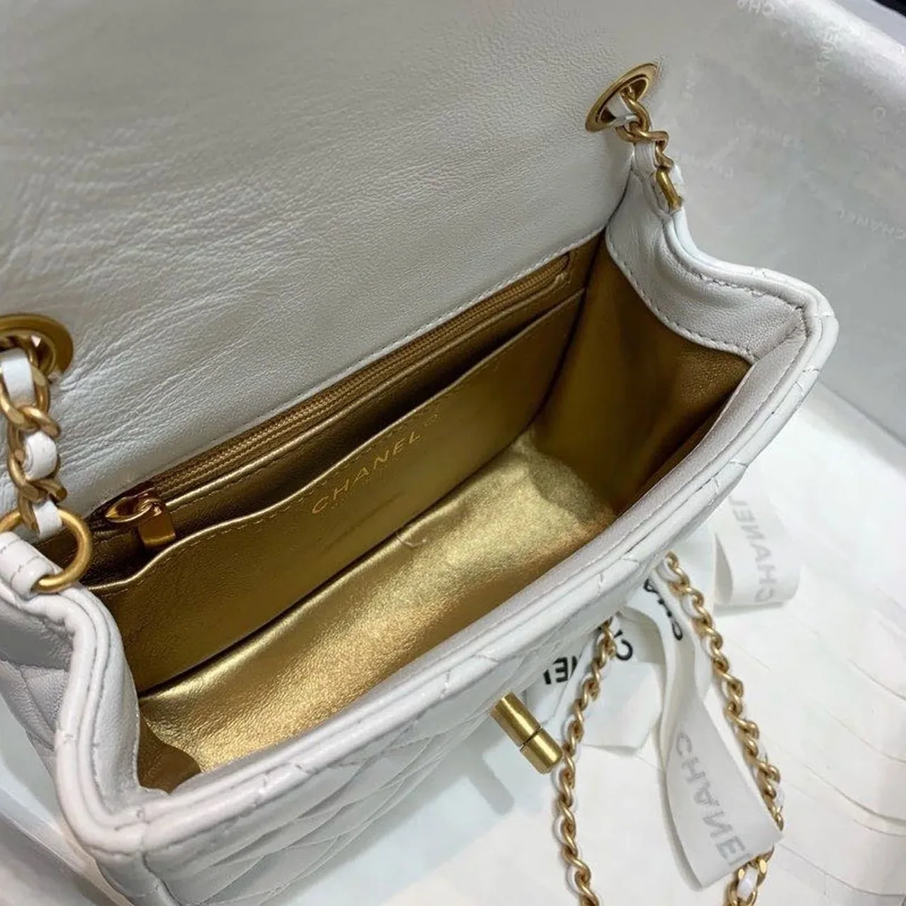 Chanel Flap Bag With CC Ball On Strap Mini Crossbody in White Gold Hardware Chanel Flap Bag With CC Ball On Strap Mini Crossbody in White Gold Hardware