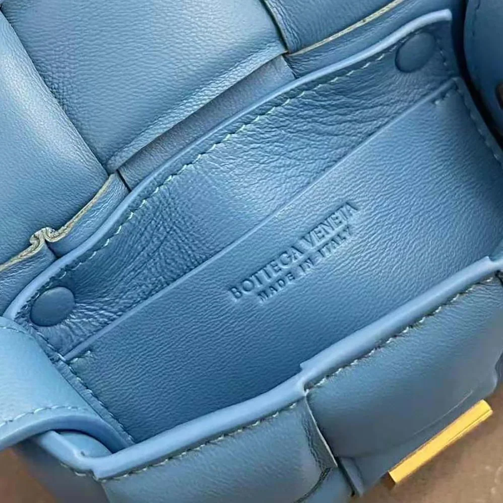 Bottega Veneta Candy Padded Cassette Mini Padded Intreccio Leather Cross-Body Bag for Women in Blue Bottega Veneta Candy Padded Cassette Mini Padded Intreccio Leather Cross-Body Bag for Women in Blue