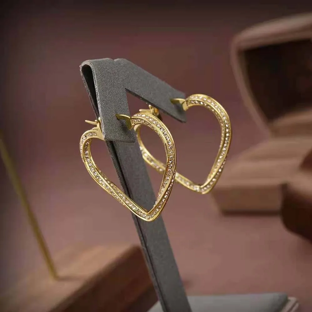 Saint Laurent YSL Smoking Twisted Heart Hoop Earrings in Metal and Crystal for Women Saint Laurent YSL Smoking Twisted Heart Hoop Earrings in Metal and Crystal for Women