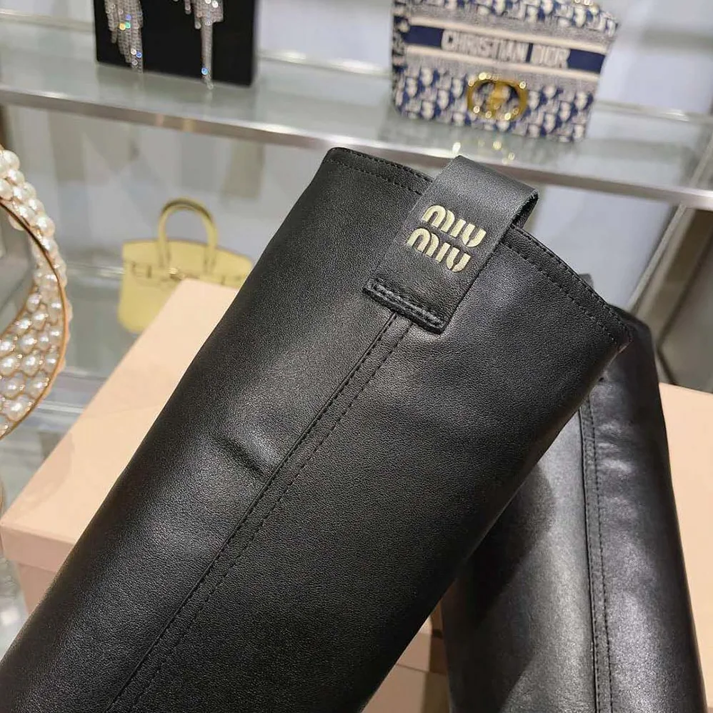 Miu Miu Leather Booties with Screen-printed Logo for Women in Black