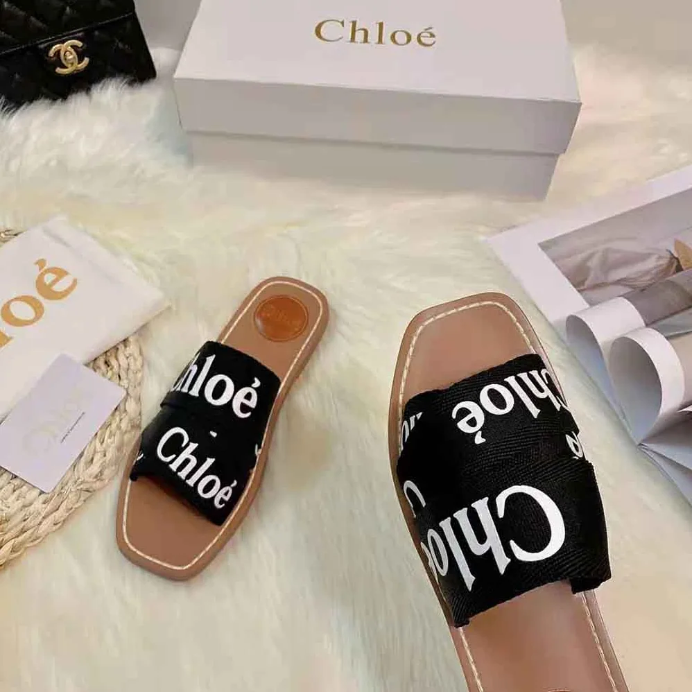 Chloe Woody Flat Mule in Canvas for Women in Black Chloe Woody Flat Mule in Canvas for Women in Black