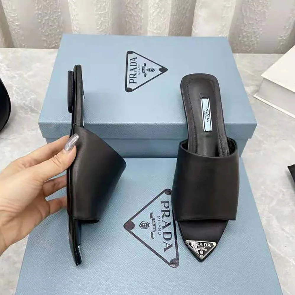 Prada Brushed Leather Slides with a Modernist Line Feature an Unexpected for Women