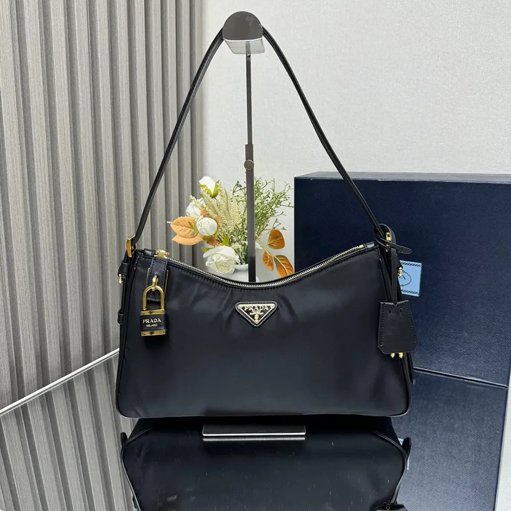 Prada Aimée large Re-Nylon and Leather Shoulder Bag with Padlock for Women Prada Aimée large Re-Nylon and Leather Shoulder Bag with Padlock for Women
