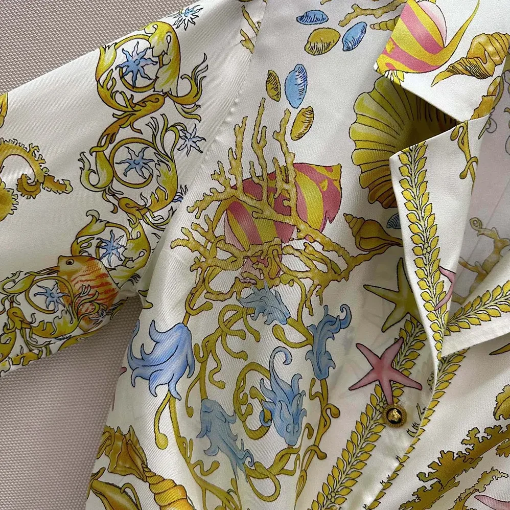 Versace Underwater Barocco Knotted Crop Silk Shirt for Women in Yellow Versace Underwater Barocco Knotted Crop Silk Shirt for Women in Yellow