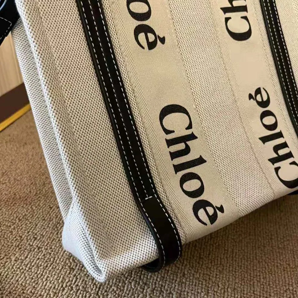 Chloe Small Woody Tote Bag in Cotton Canvas and Shiny Calfskin with Woody Ribbo for Women in Black Chloe Small Woody Tote Bag in Cotton Canvas and Shiny Calfskin with Woody Ribbo for Women in Black