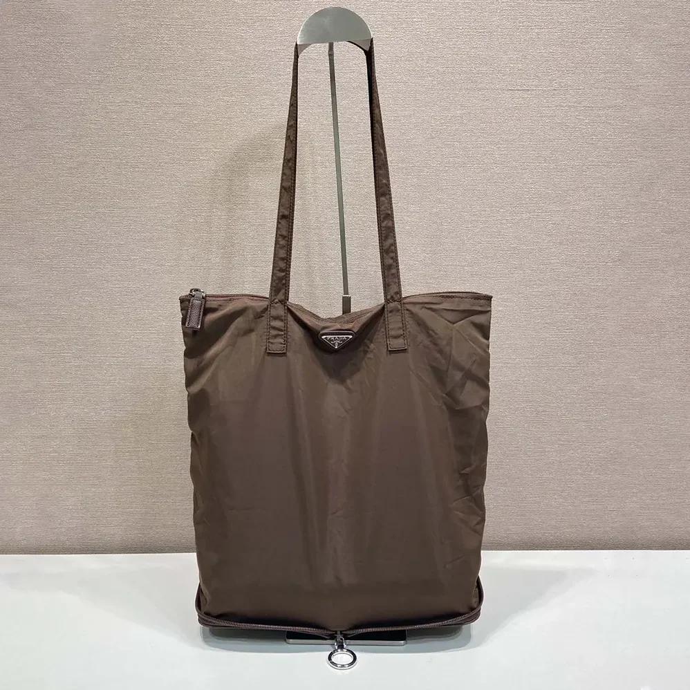 Prada Saffiano Leather Pendant With Re-Nylon Tote Bag for Women in Sienna Prada Saffiano Leather Pendant With Re-Nylon Tote Bag for Women in Sienna