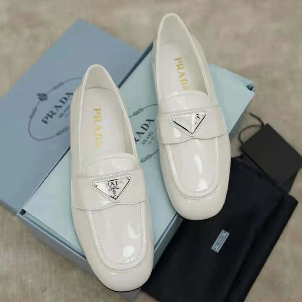 Prada Patent Leather Loafers in 5mm Heel for Women in White Prada Patent Leather Loafers in 5mm Heel for Women in White