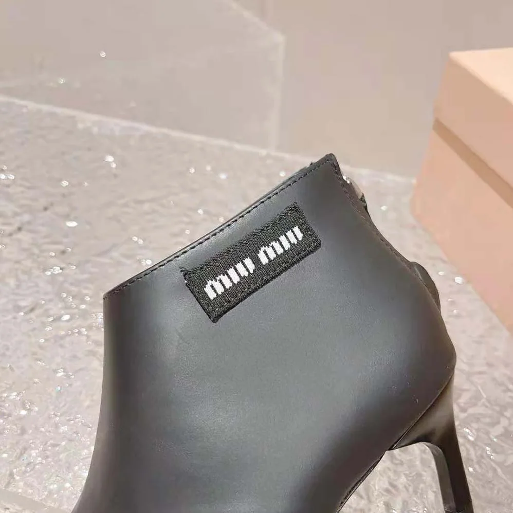 Miu Miu Leather Thong Booties for Women in Black