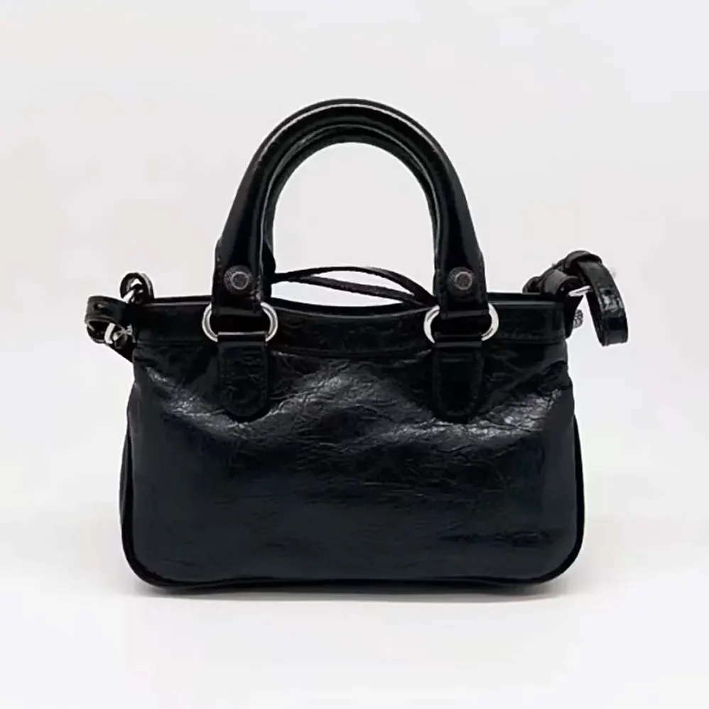 Balenciaga Neo Cagole XS Handbag in Black Arena Lambskin for Women