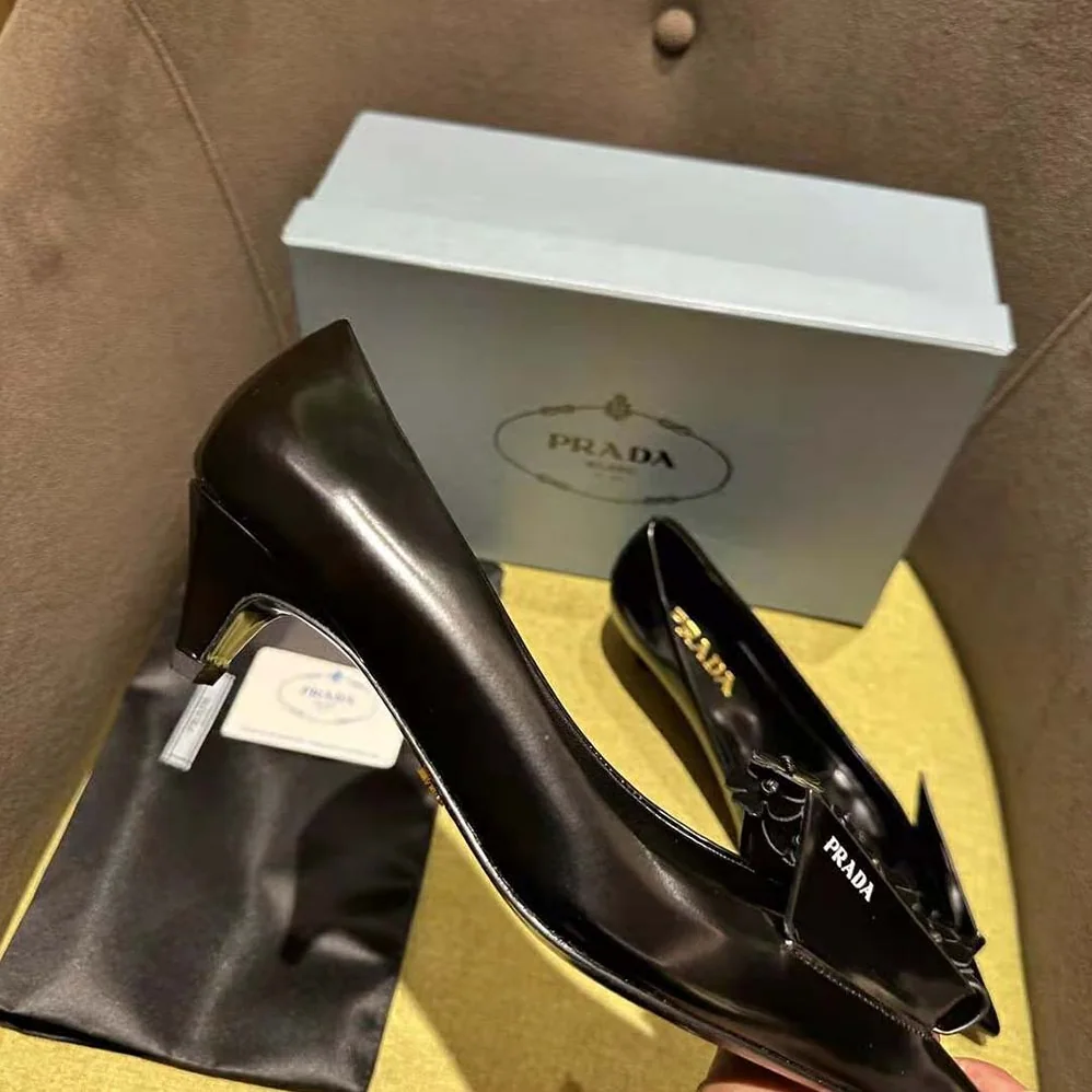 Prada Brushed Leather Pumps with Floral Appliqués for Women in Black