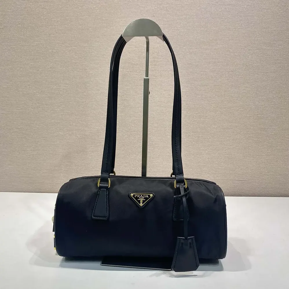 Prada Re-Nylon and Leather Medium Top-handle Bag with Padlock for Women in Black Prada Re-Nylon and Leather Medium Top-handle Bag with Padlock for Women in Black