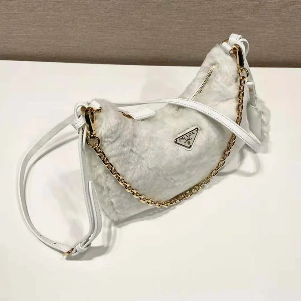Prada Shearling Mini-Bag with the Enameled Metal Triangle Logo for Women in White Prada Shearling Mini-Bag with the Enameled Metal Triangle Logo for Women in White