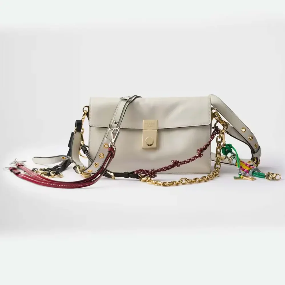 Prada Soft Sound Small Leather Shoulder Bag with Charms for Women in White Prada Soft Sound Small Leather Shoulder Bag with Charms for Women in White