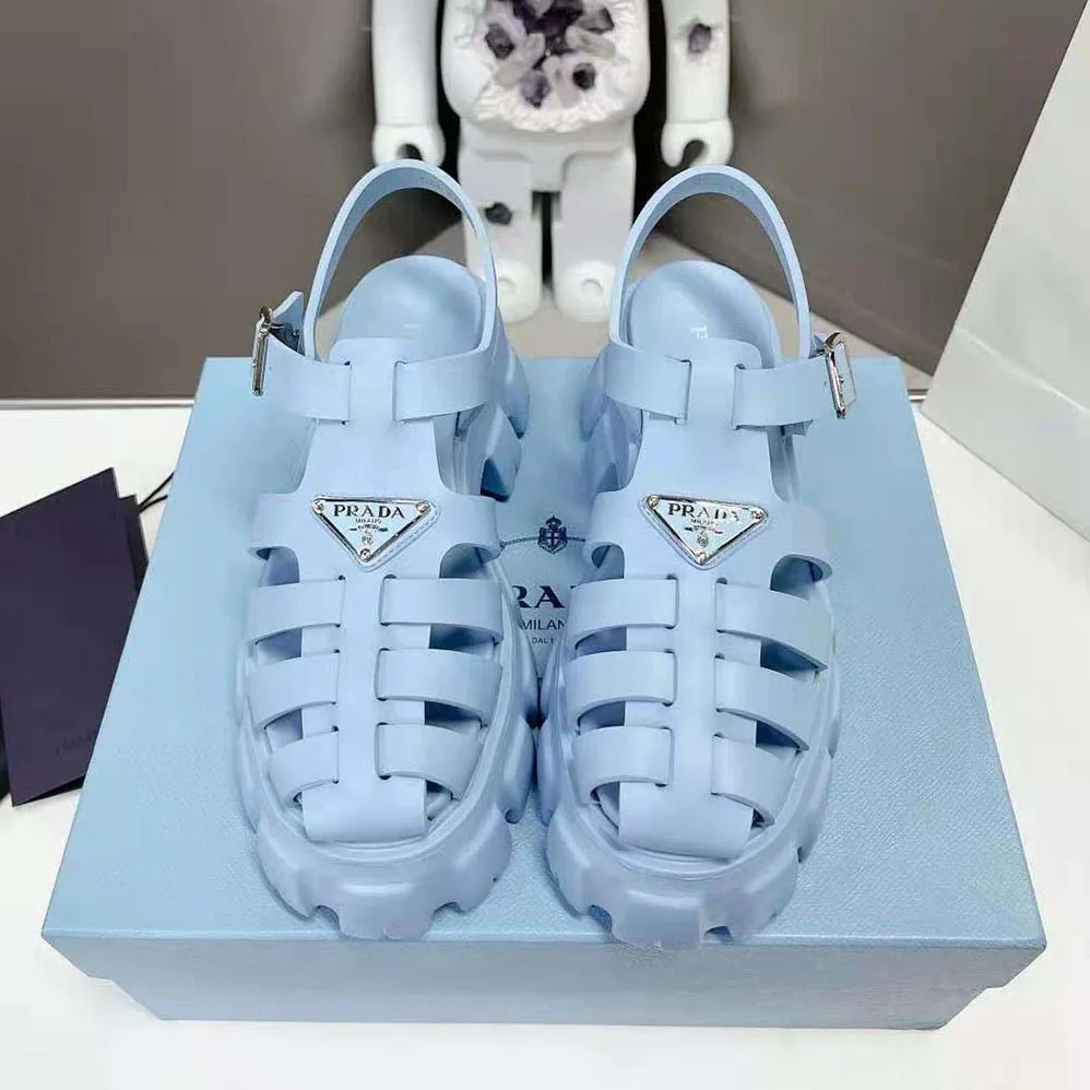 Prada Foam Rubber Sandals with Enameled Metal Triangle Logo for Women in Blue Prada Foam Rubber Sandals with Enameled Metal Triangle Logo for Women in Blue