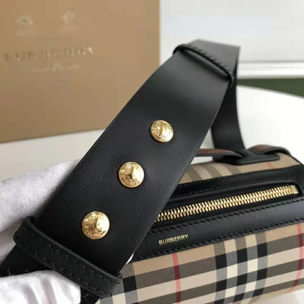 Burberry The Icon Stripe E-canvas and Leather Barrel Bag for Women in Brown Burberry The Icon Stripe E-canvas and Leather Barrel Bag for Women in Brown