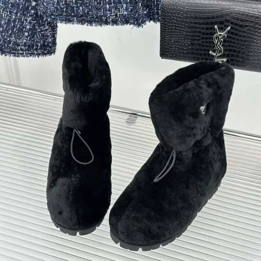 Prada Shearling Booties with Enameled Metal Triangle Logo for Women in Black