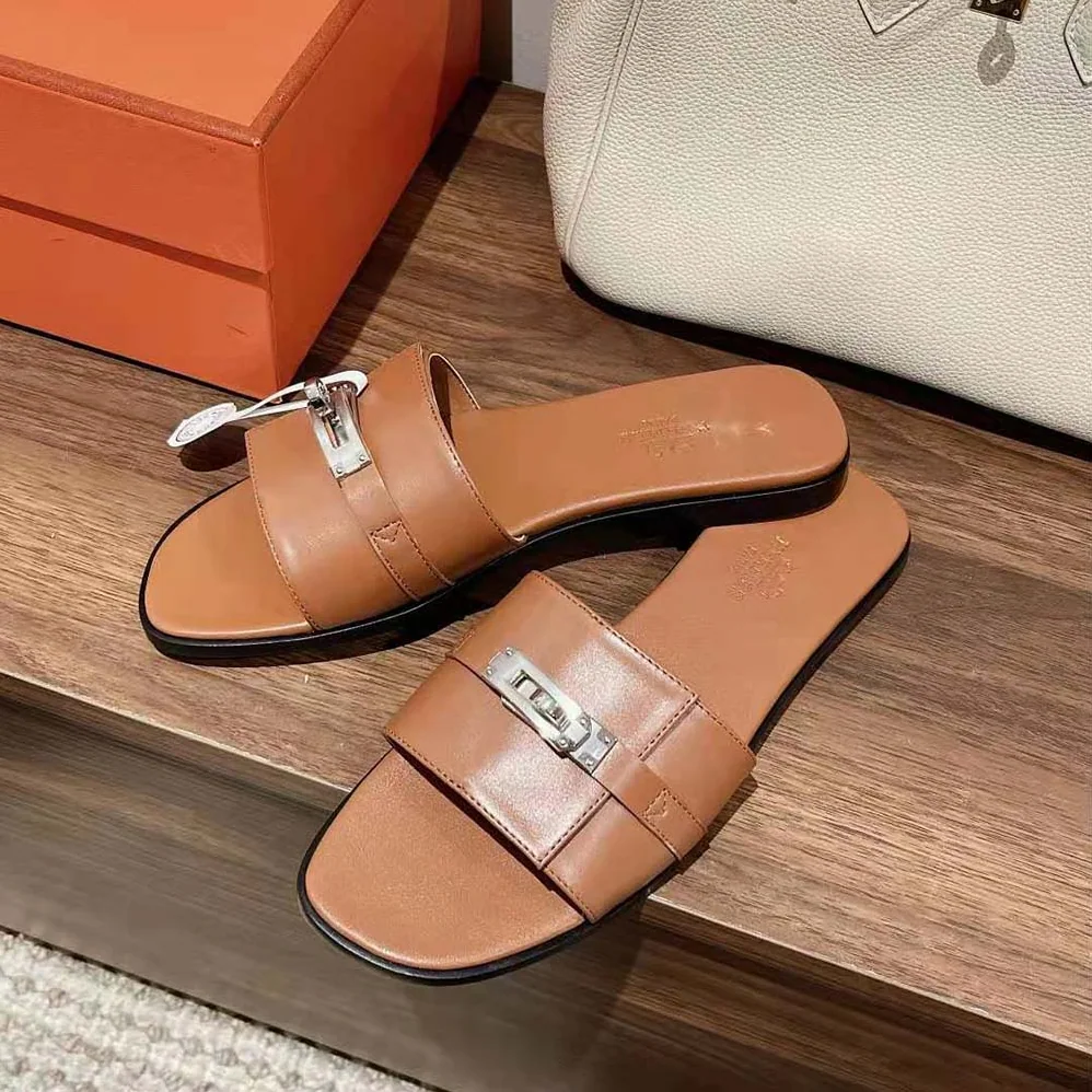 Hermes Giulia Sandal in Calfskin with Iconic Palladium-Plated Kelly Buckle for Women in Brown Hermes Giulia Sandal in Calfskin with Iconic Palladium-Plated Kelly Buckle for Women in Brown