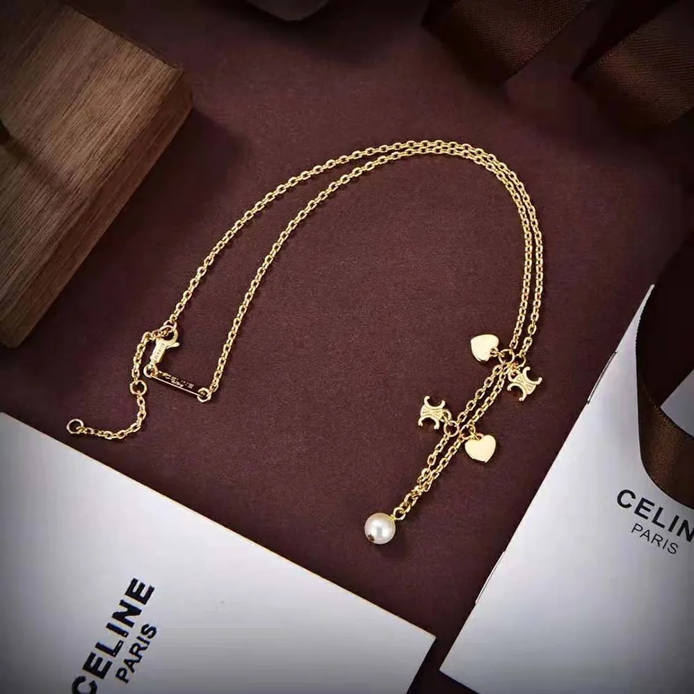 Celine Cœur Celine Charms Necklace in Brass with Gold Finish and Resin Pearl for Women Celine Cœur Celine Charms Necklace in Brass with Gold Finish and Resin Pearl for Women