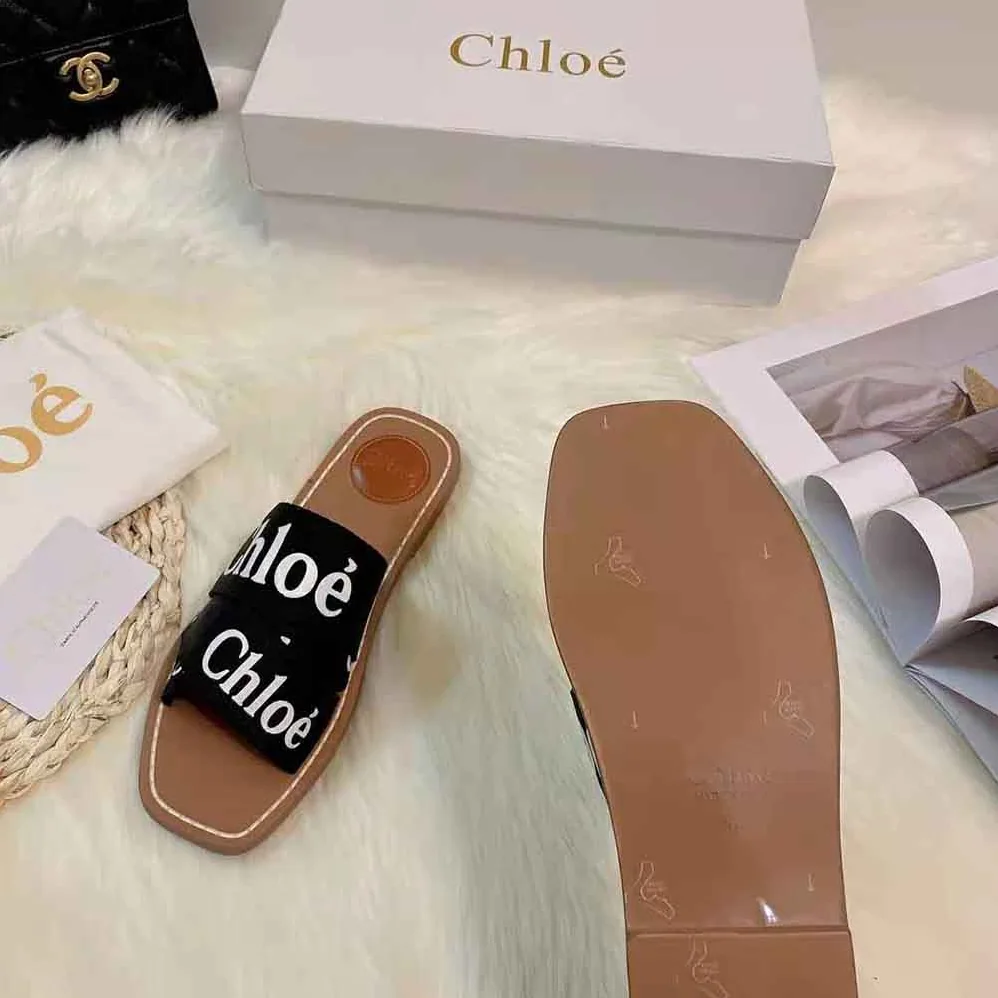 Chloe Woody Flat Mule in Canvas for Women in Black Chloe Woody Flat Mule in Canvas for Women in Black