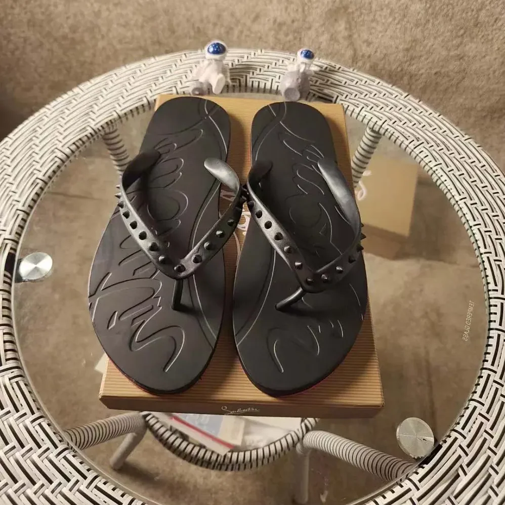Christian Louboutin Loubi Donna Spike Red Sole Flip Flops for Men in Black Christian Louboutin Loubi Donna Spike Red Sole Flip Flops for Men in Black