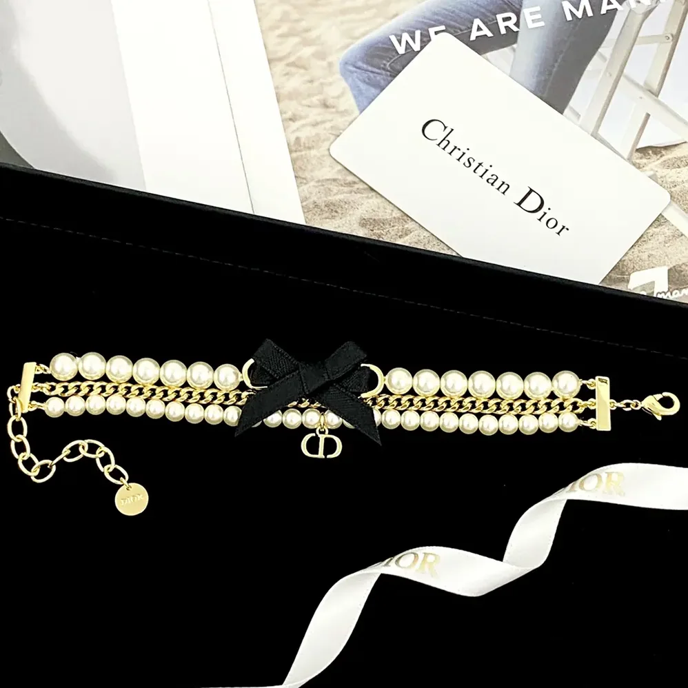 Dior Le Nœud de Dior Bracelet Gold-Finish Metal with White Resin Pearls and Black Satin for Women Dior Le Nœud de Dior Bracelet Gold-Finish Metal with White Resin Pearls and Black Satin for Women