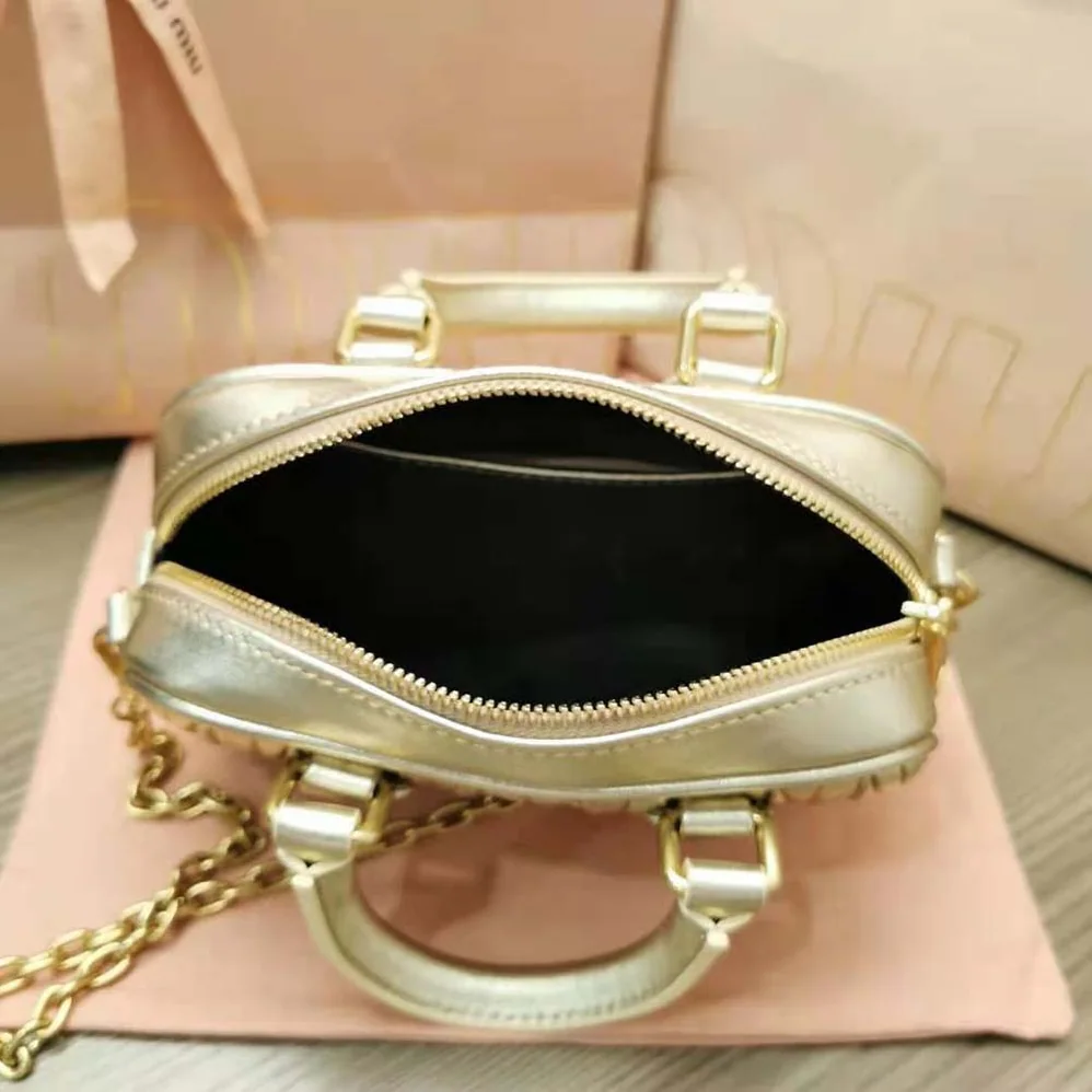 Miu Miu Matelassé Nappa Leather Top-Handle Mini-Bag for Women in Gold