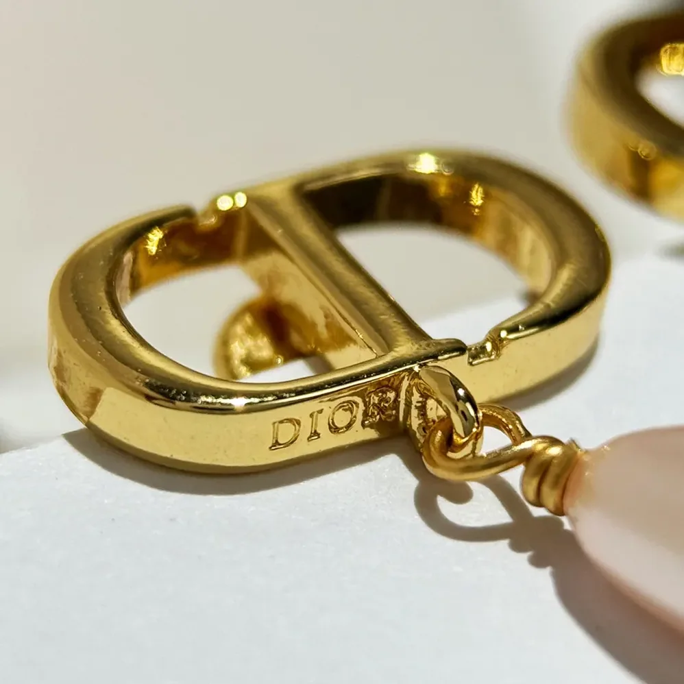 Dior Petit CD Earrings Gold-Finish Metal and Iridescent Pink Resin Pearls for Women Dior Petit CD Earrings Gold-Finish Metal and Iridescent Pink Resin Pearls for Women